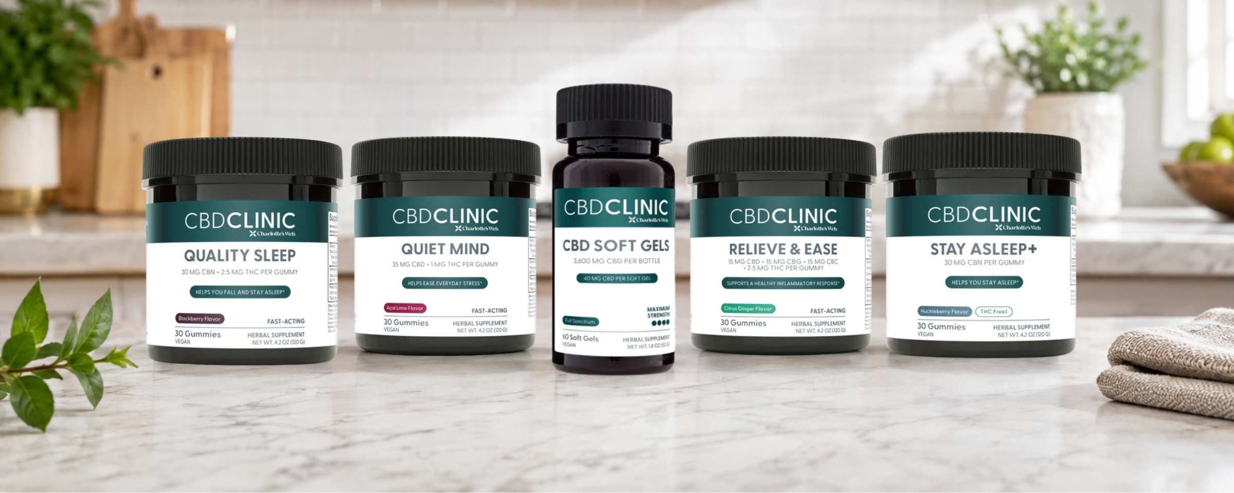Five CBD CLINIC supplement bottles and jars